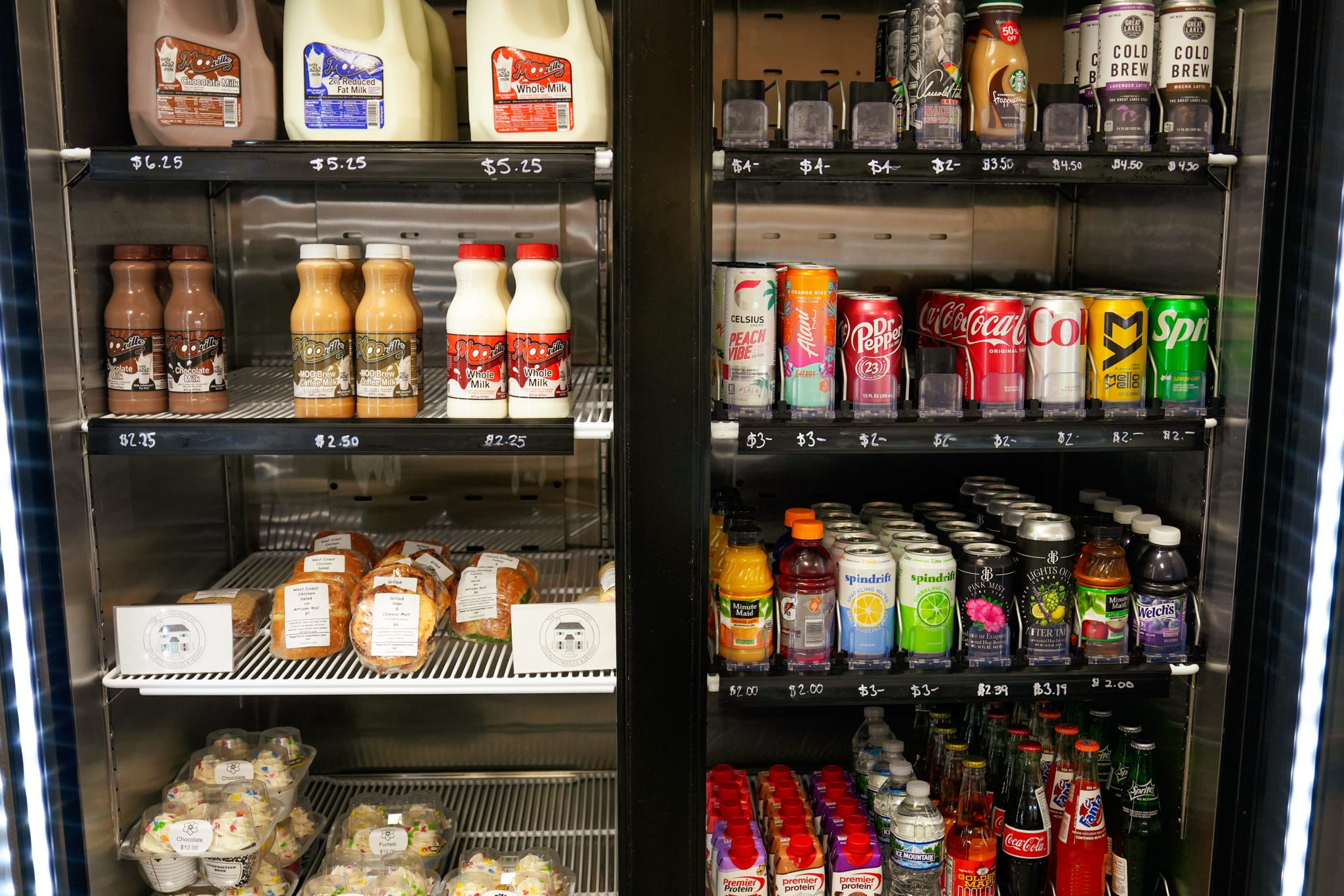 Market shelves stocked with local drinks, sauces and pantry staples